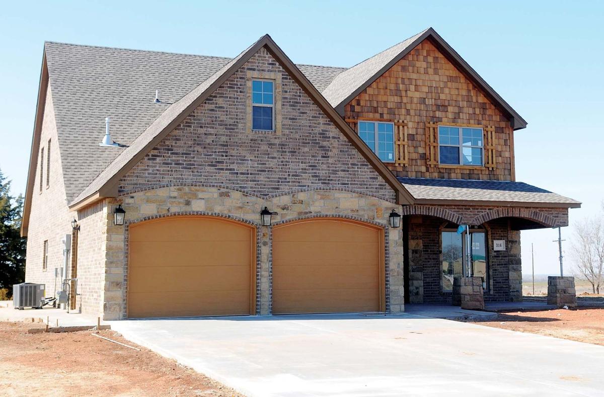 Members of Hennessey group work to promote the community News