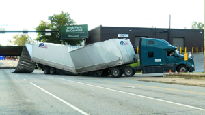 Semi-Truck Carrying Busch Light Collides With Low Bridge in Erie
