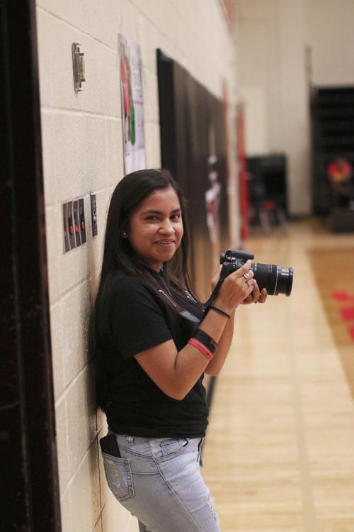 School photographer capturing the game