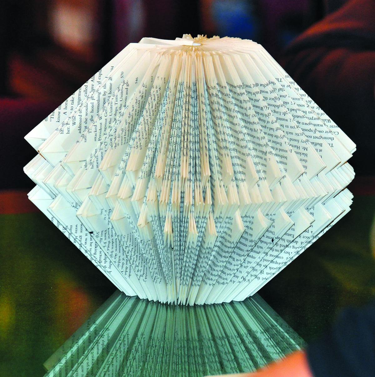 TURNING PAGES INTO ART: Book origami creations raising money for
