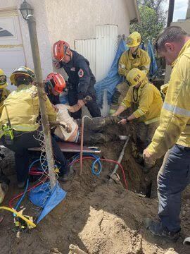 Two construction workers are rescued after being trapped in trench in ...