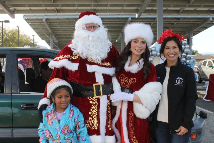 Many families have happy holiday because of Fontana Santas toy
