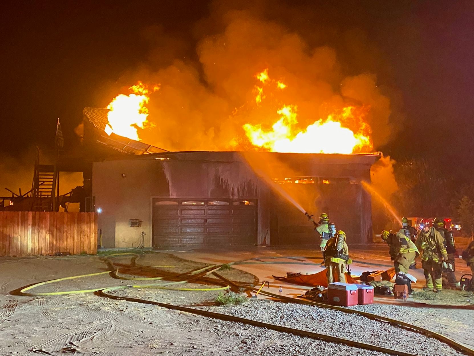 Four firefighters are injured while battling blaze at house which had ...