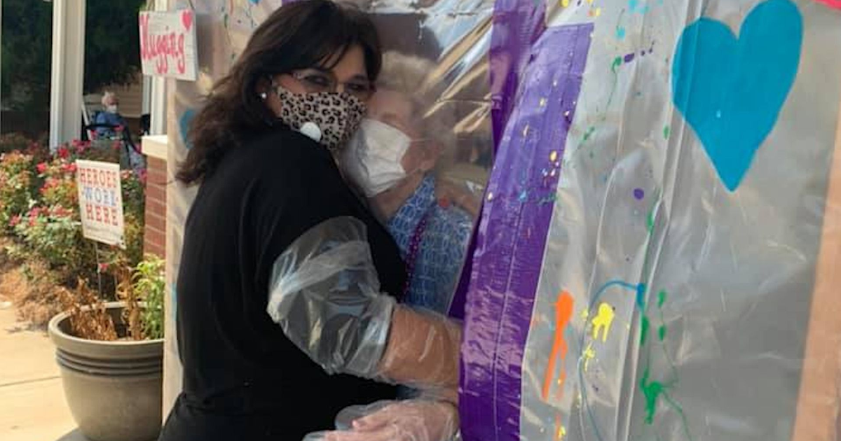 Nursing home installs hugging booth so visitors can hold their loved ...