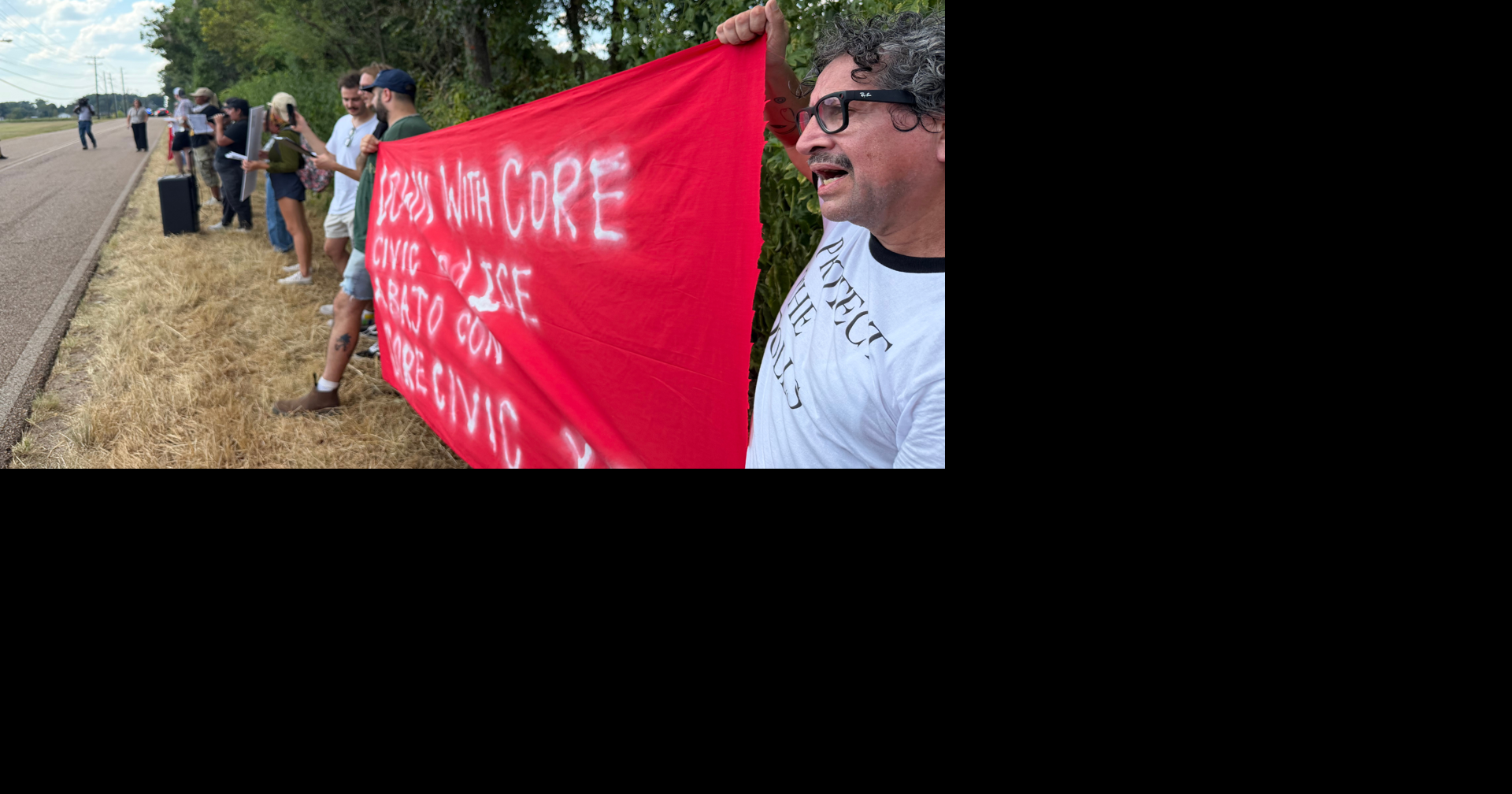 Protesters march outside immigration detention center in Tipton County