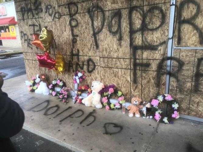 PHOTOS: Memorial for Young Dolph grows outside Memphis bakery ...