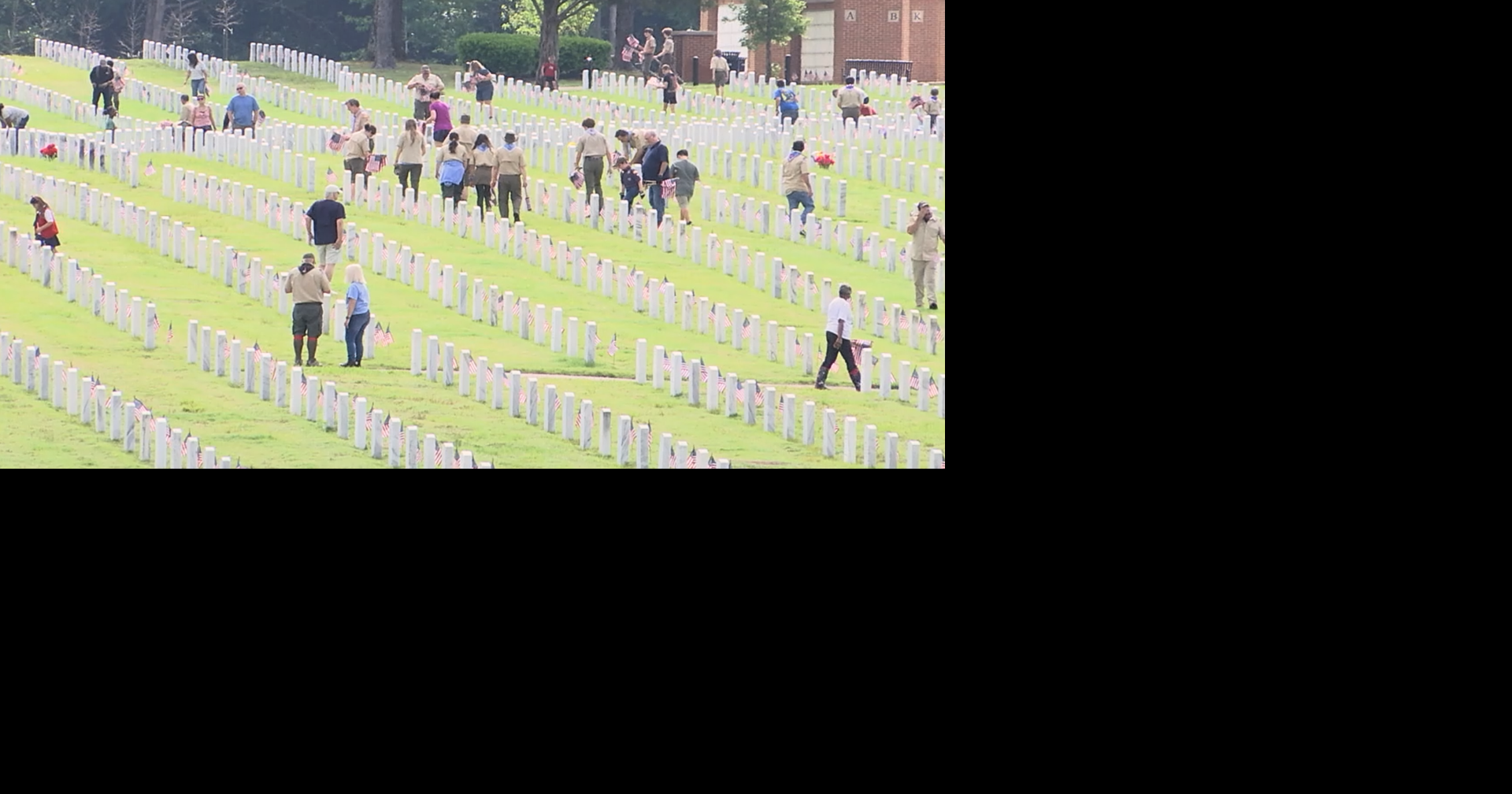 Volunteers place flags at West Tennessee Veterans Cemetery ahead of Memorial Day