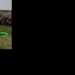 Family seeks answers after a memorial dinosaur statue was stolen from their yard