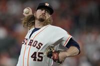 Atlanta Braves relief pitcher Tyler Matzek throws during the seventh inning  of Game 1 in baseball's World Series between the Houston Astros and the  Atlanta Braves Tuesday, Oct. 26, 2021, in Houston. (