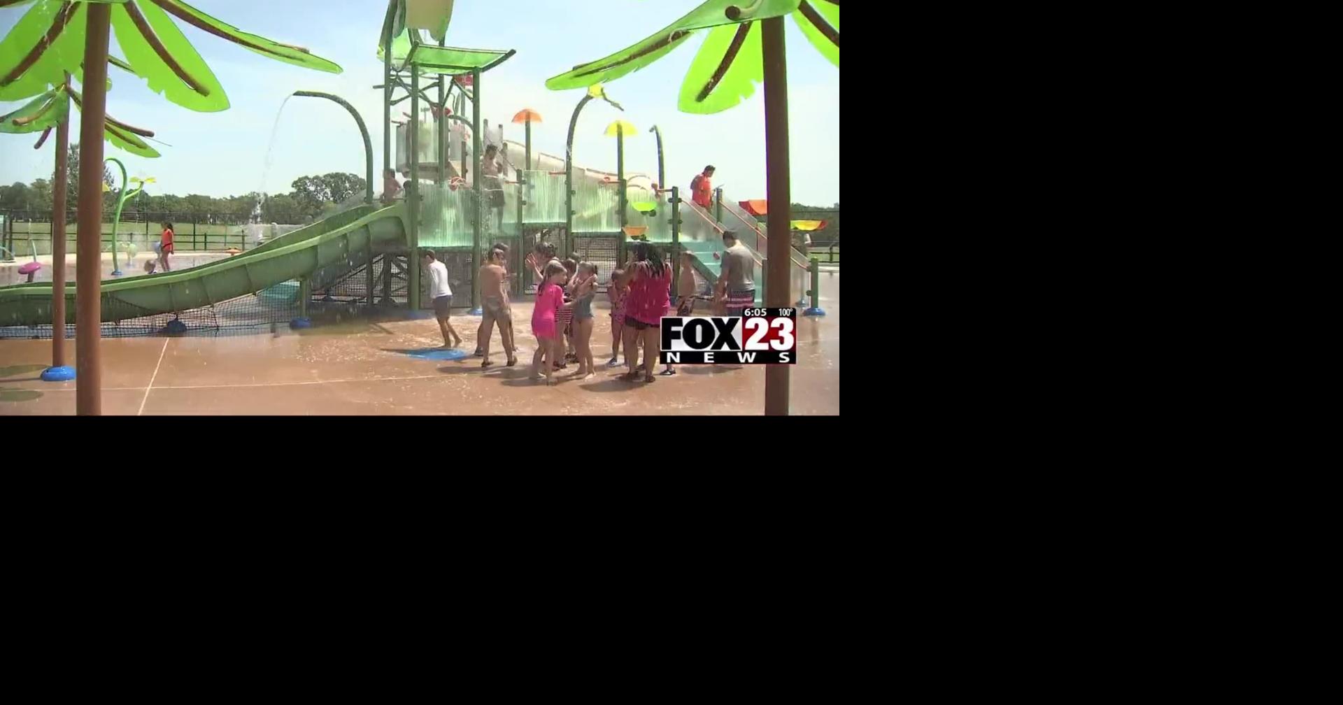 Parents keeping kids cool at Chandler Park splash pad during Excessive