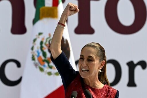 Mexico's President Claudia Sheinbaum gestures during a rally marking the seventh anniversary of the Morena party in government in Mexico City