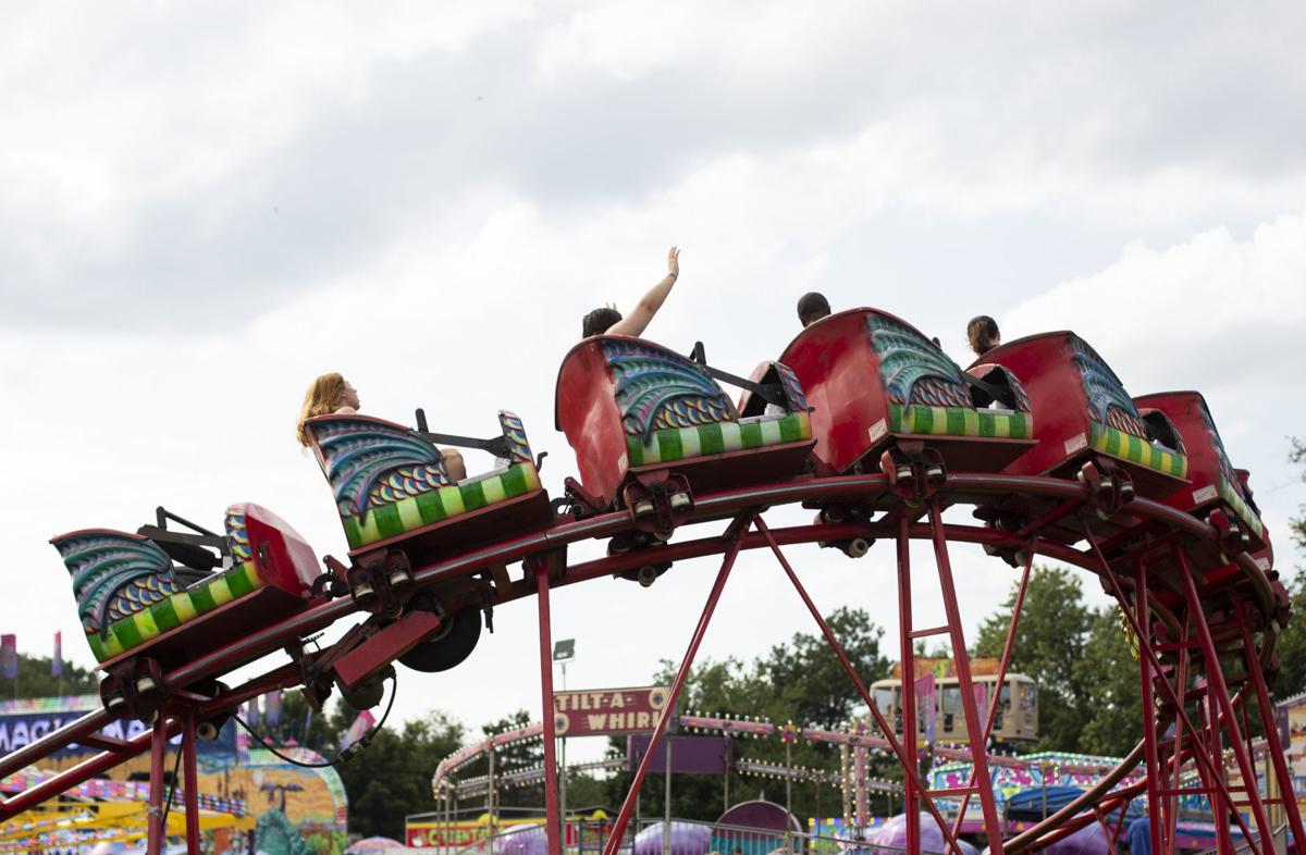 Fairgoers enjoy attractions and the calm between the storms