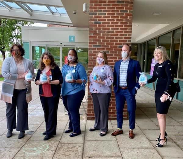 Representatives from HMP Properties deliver gift bags to Stafford Hospital staff