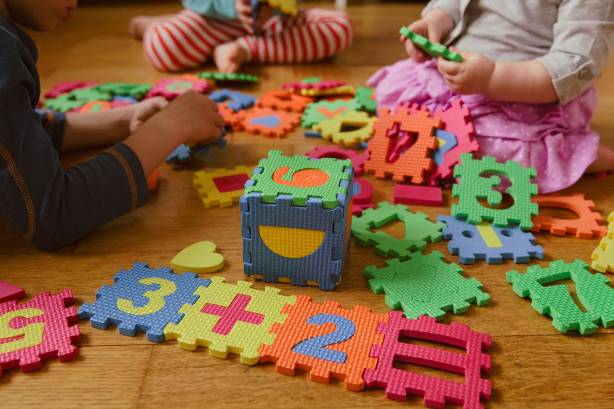 kids playing with puzzle, education concept