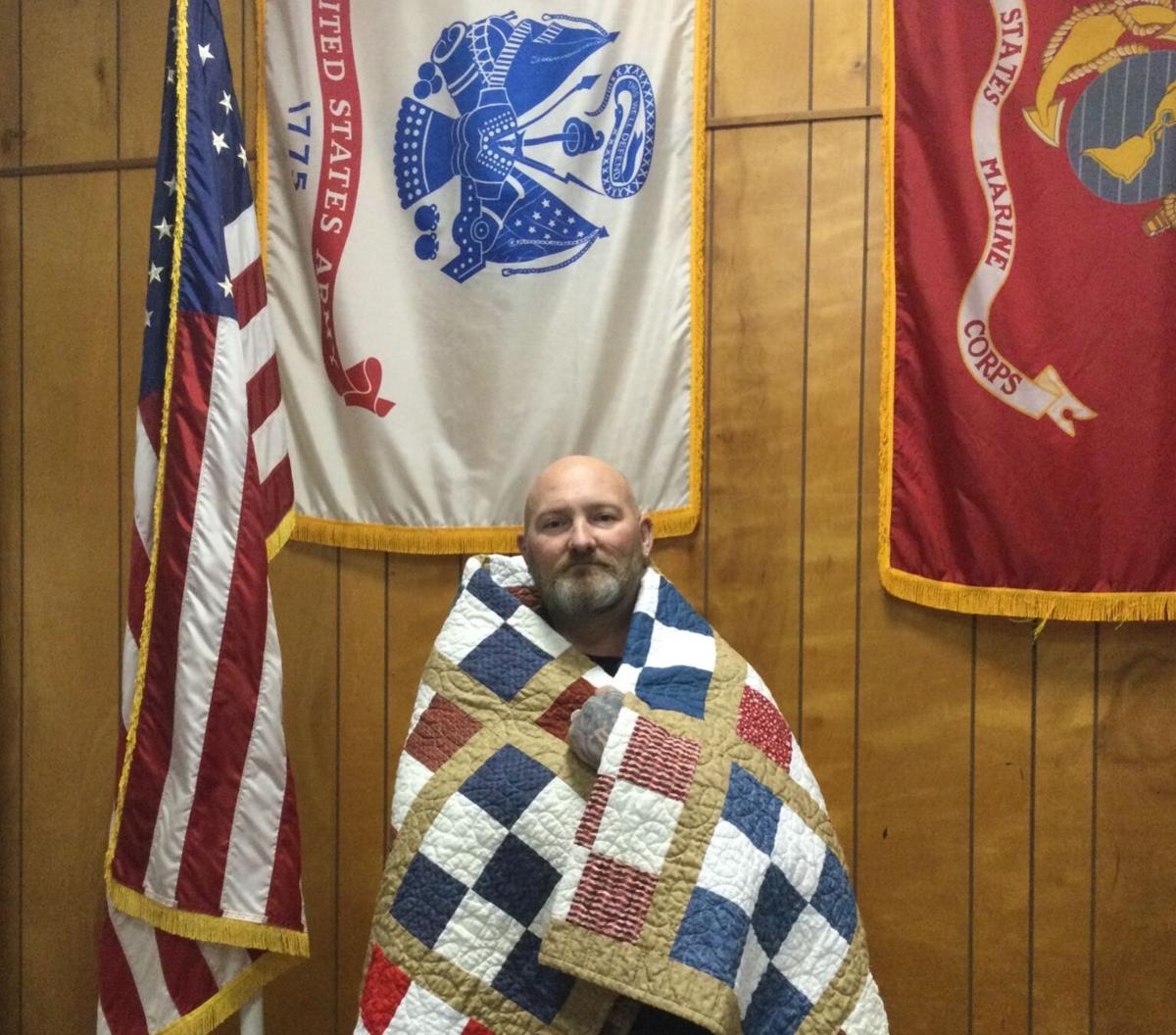 Jeremy Dennis receives a Quilt of Valor