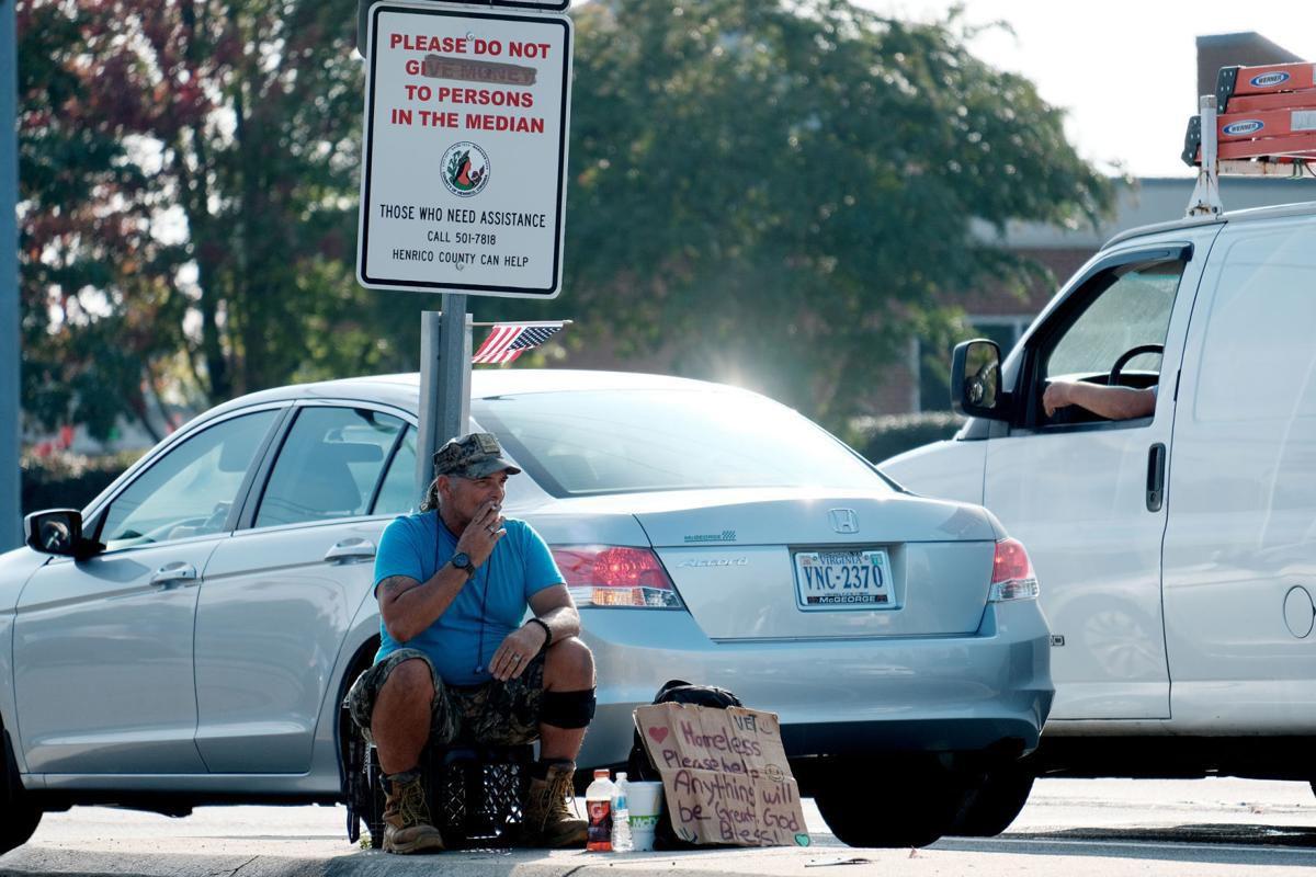 PHOTO panhandling sign
