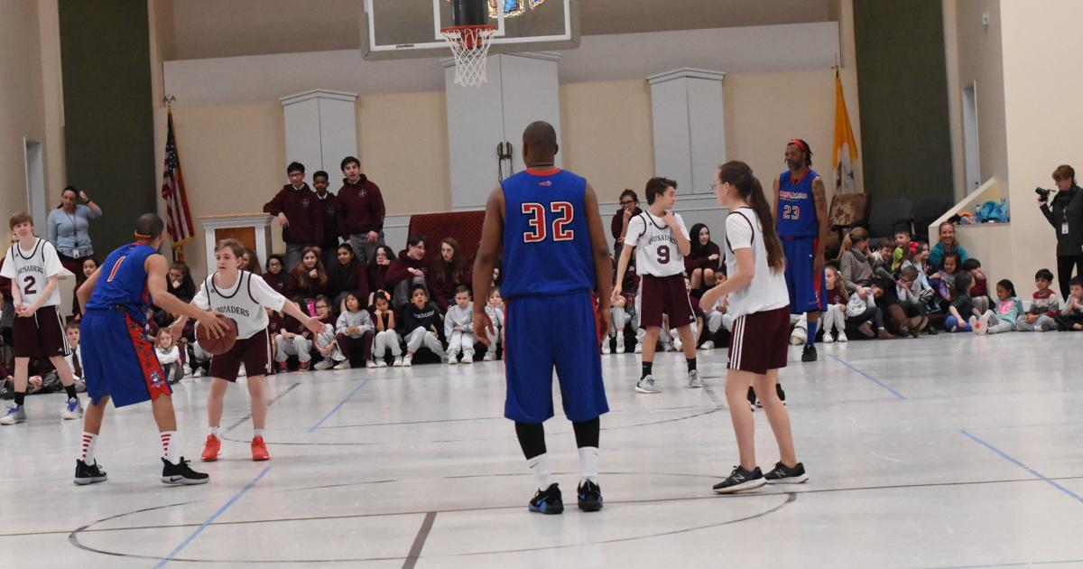 HOLY CROSS: Crusaders welcome the Harlem Rockets to their court