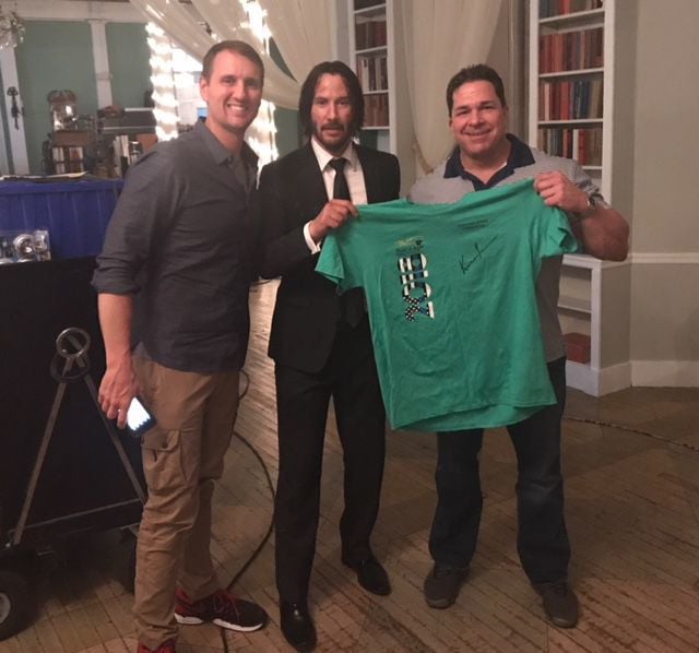 ON SET: Keanu Reeves signs shirts for Special Olympics VA