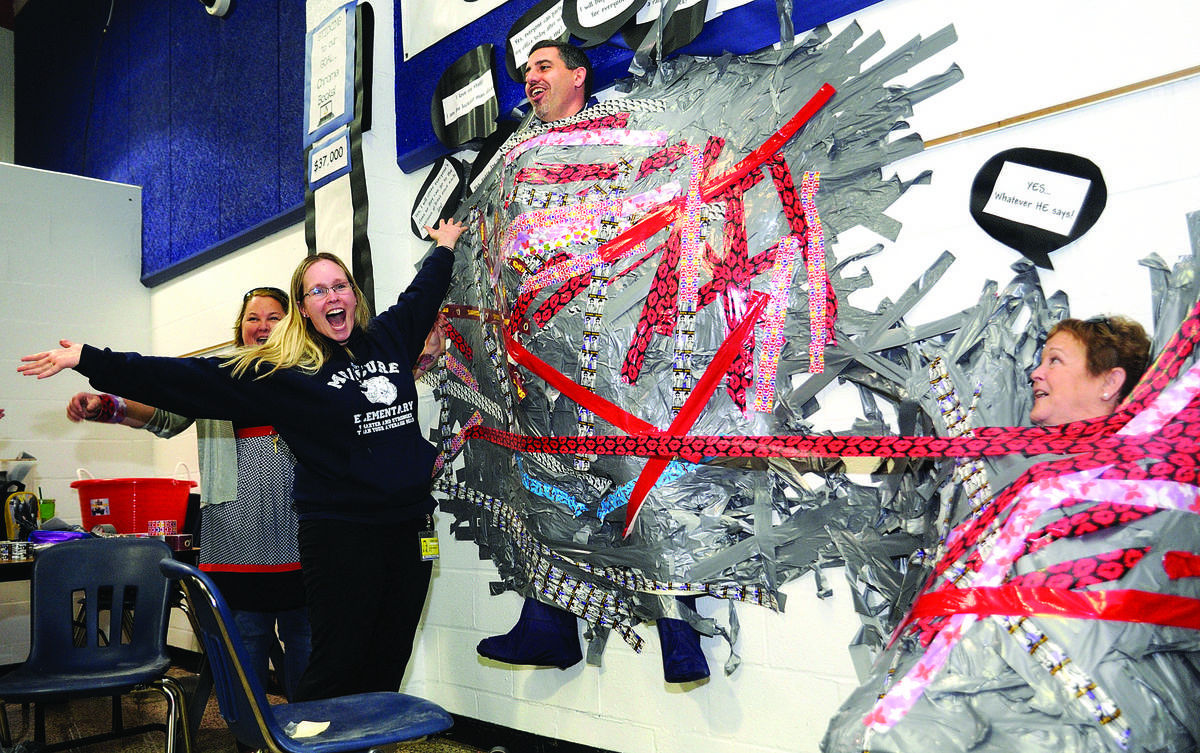 School leaders duct taped to wall raise more than expected