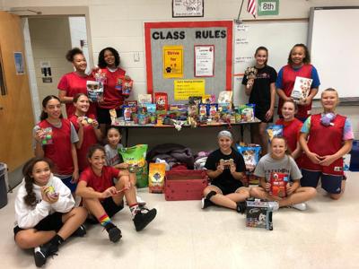 SCORE: Lady Tigers collect donations for SPCA