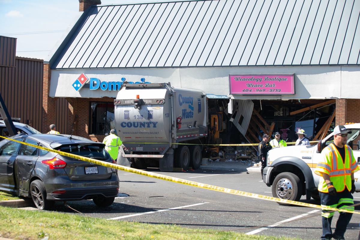 Trash truck crashes into Spotsylvania shopping center
