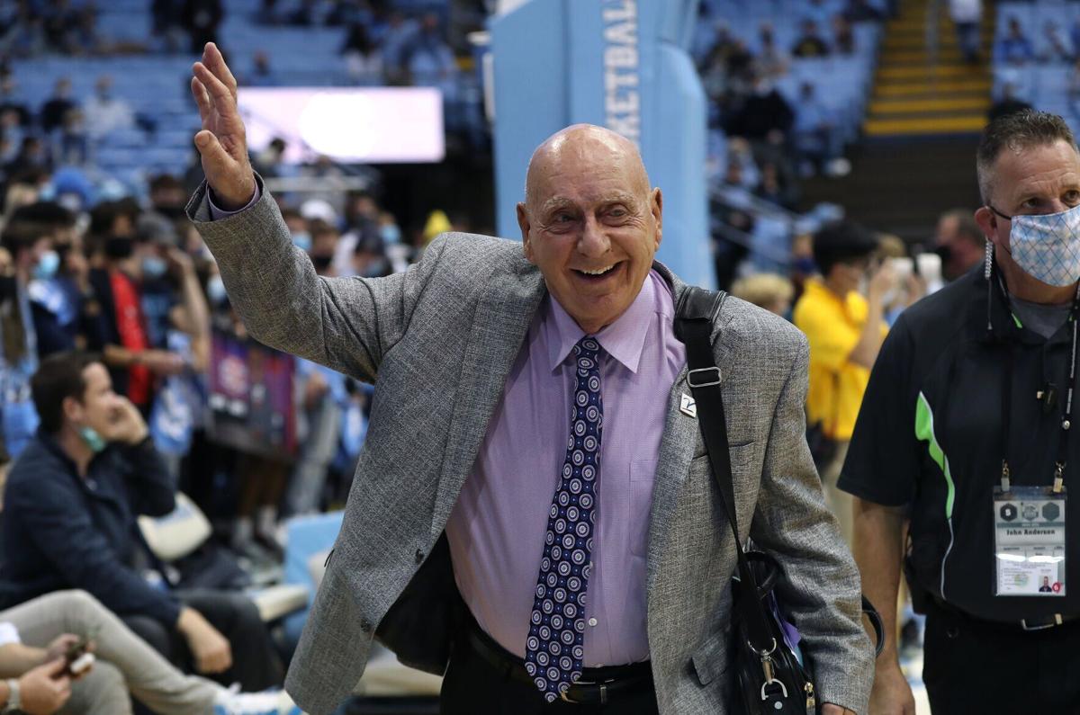 ESPN announcer Dick Vitale waves to the fans as he receives an ovation before the game between the North Carolina Tar Heels and the Michigan Wolverines at the Dean E. Smith Center on December 01, 2021 in Chapel Hill, North Carolina.