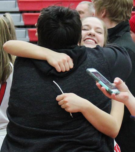 Reagan Aronson hugs Stacy Bickford