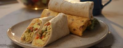 Conquer life on-the-go with this cheesy and nutritious breakfast burrito