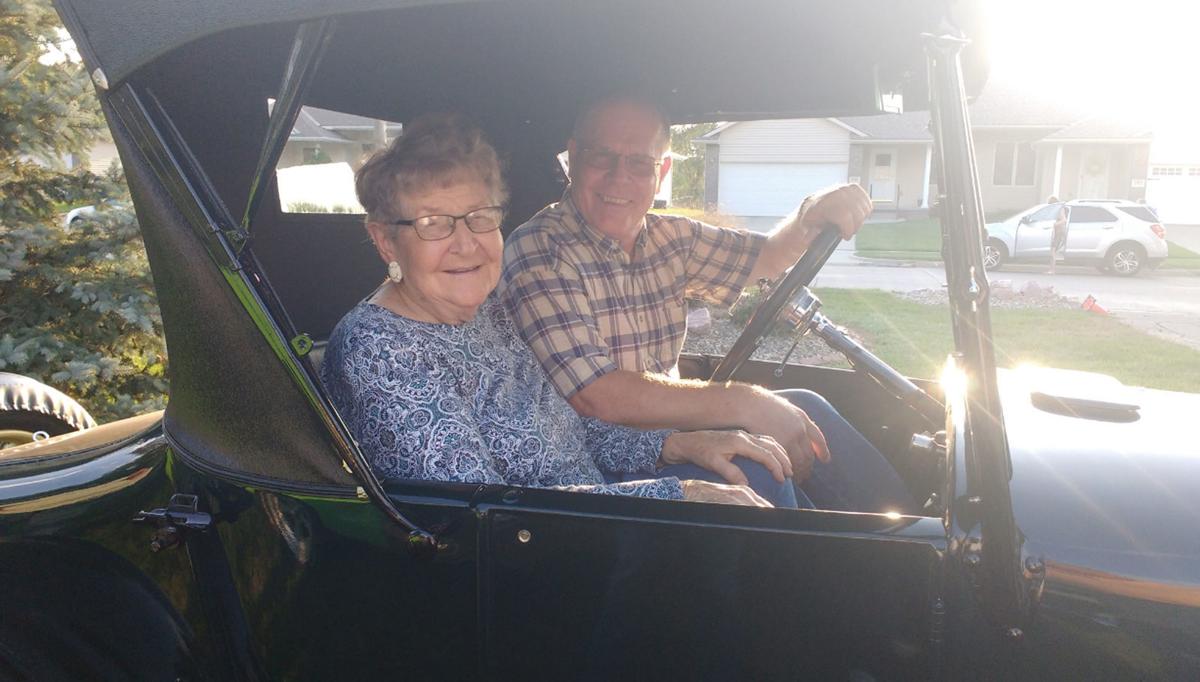 Bob Buer and passenger in Model T car