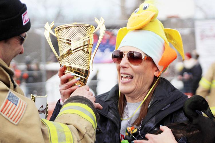 Kris Simmons smiles with championship trophy