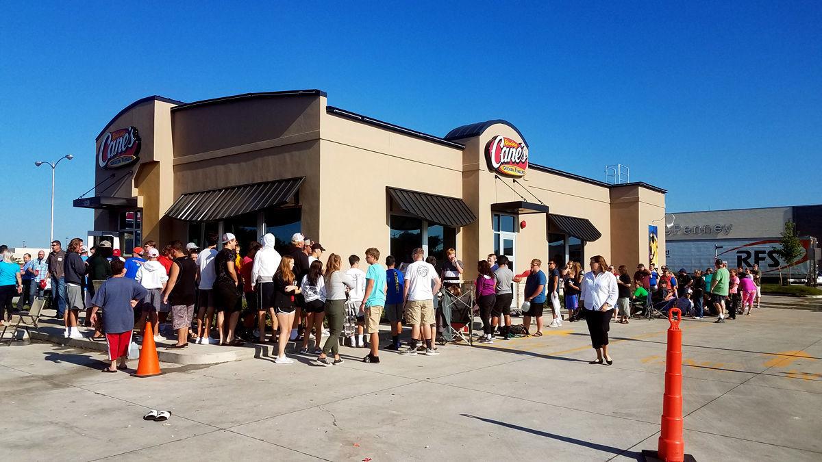 Raising Cane's owners awarded for giving back | Local News