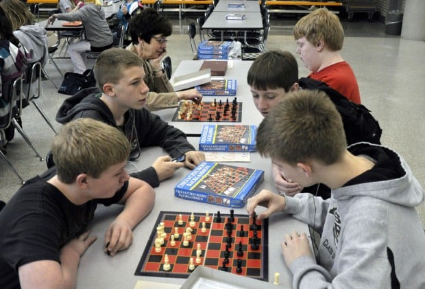 Middle school students enjoy playing chess