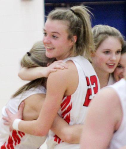 Teammates hug near end of game