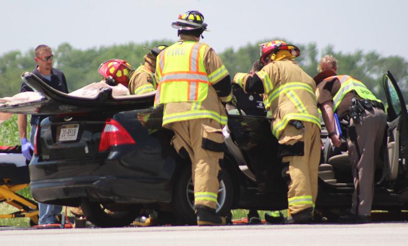 Rescue crews helping person in car