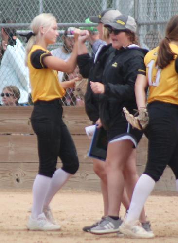 Ella Aaberg fist bump with coaches