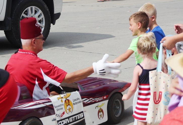 Getting a high five from Shriner in car