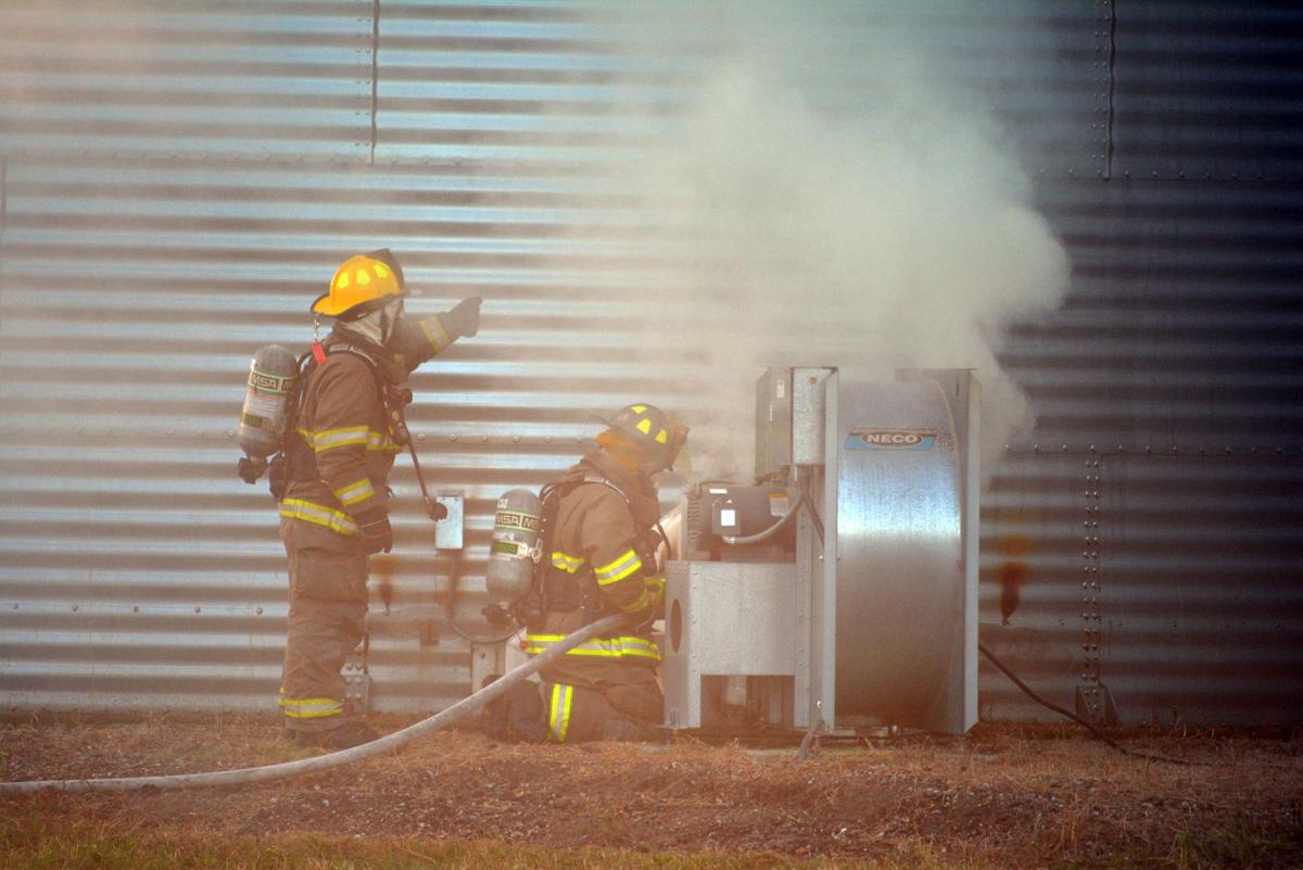 Firefighters battle grain bin fire Local News