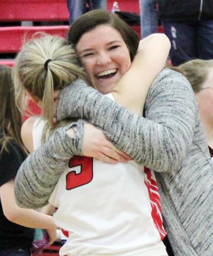 Marylyn Mozena hugs Brianna Lawson