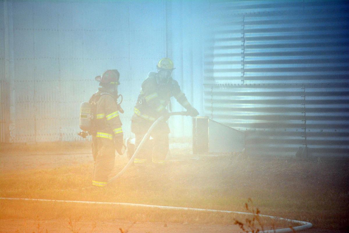 Firefighters battle grain bin fire Local News