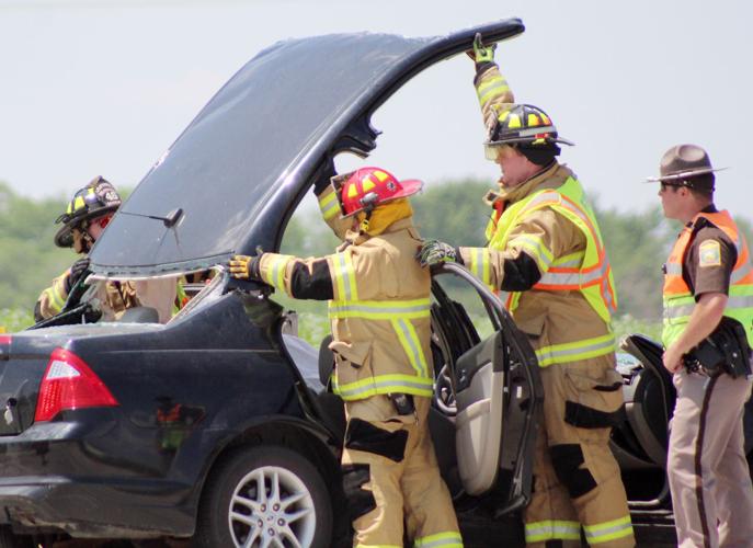 Prying roof off vehicle after accident