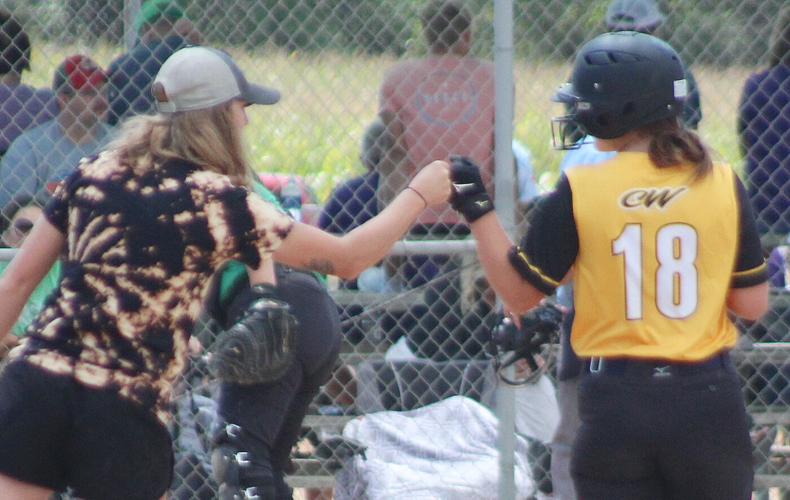 Sarah DeWispelare fist bump with Hannah Bogatz