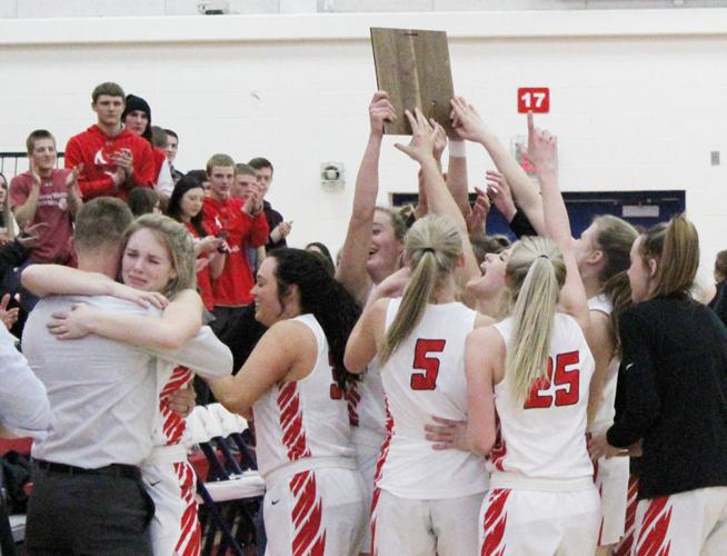 Team celebrates with district plaque
