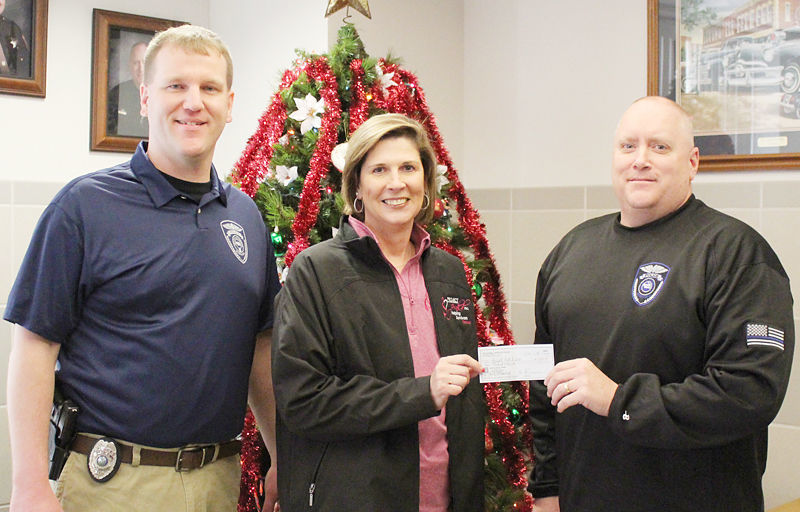 Plattsmouth police donate money to breast cancer survivors