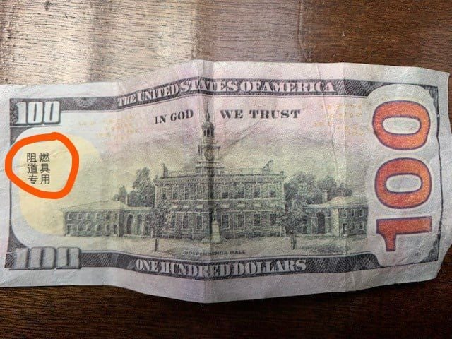 Counterfeit bills marked with Chinese letters being circulated