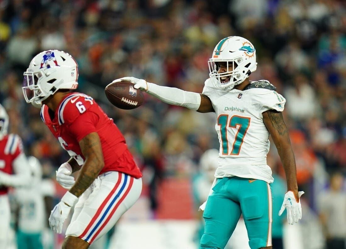 Jaylen Waddle of the Miami Dolphins runs up field against the New