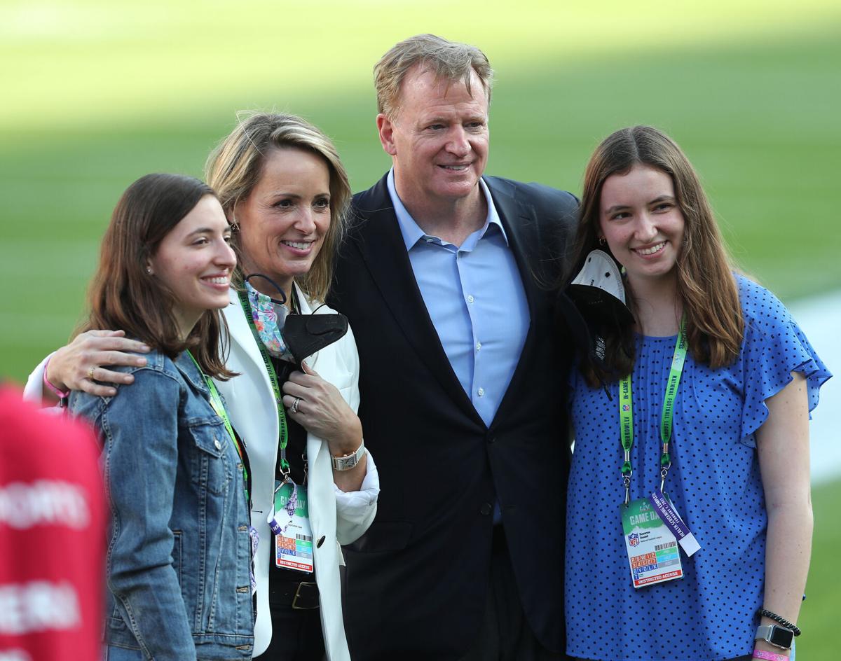 Roger Goodell, second from right, commissioner of the NFL, poses with football fans before the start of Super Bowl LV at Raymond James Stadium in Tampa, Florida, on Sunday, Feb. 7, 2021.