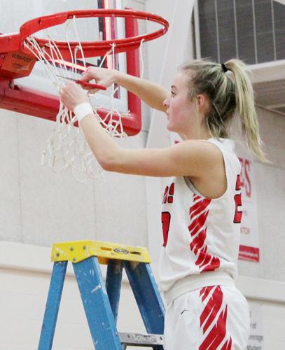 Grace Cave cuts down nets