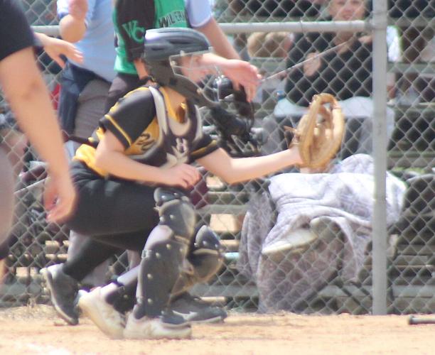 Piper Meisinger waits for throw by home plate
