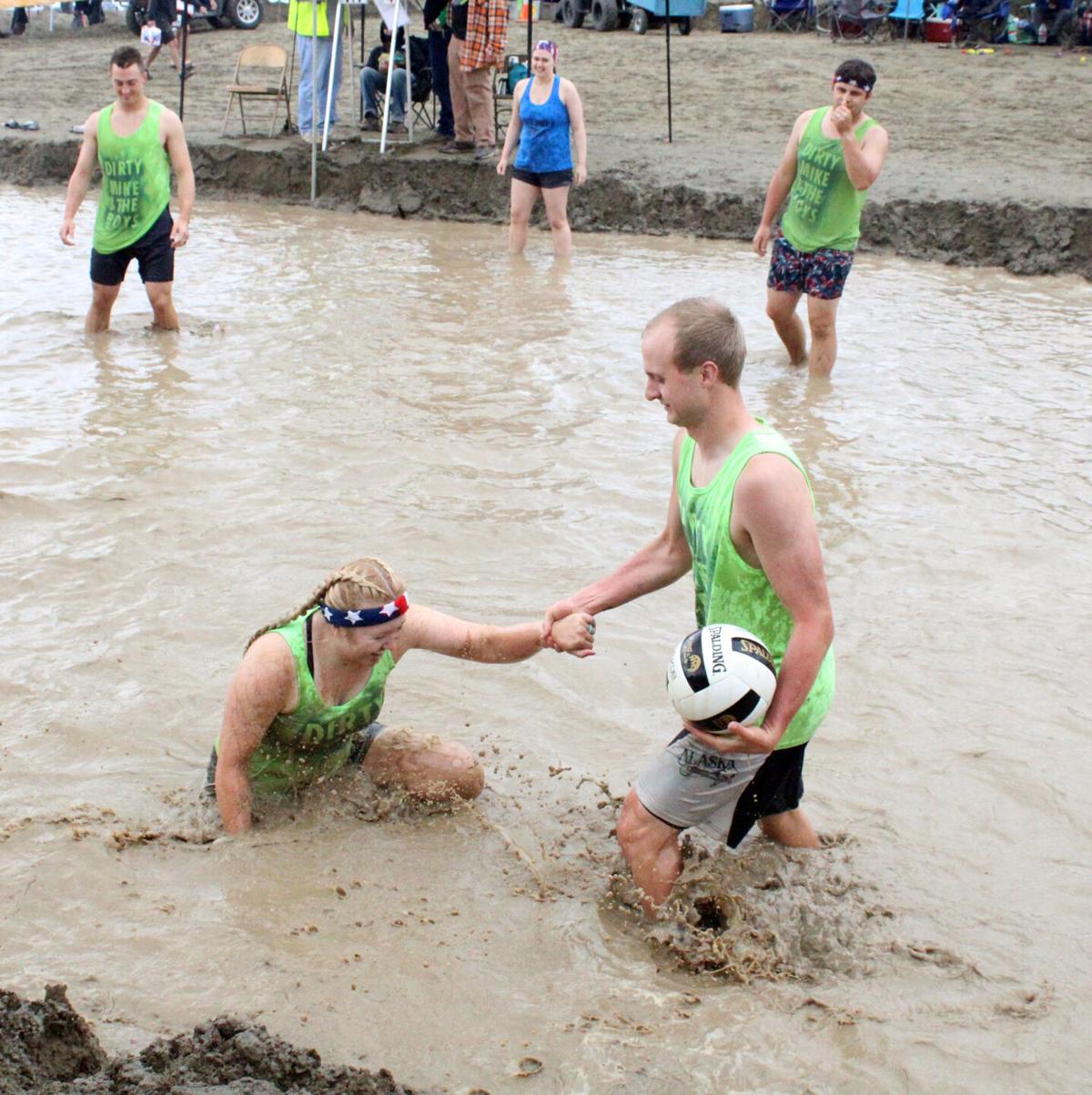 Fun in the mud; Big Lake Lions Club continues tradition with volleyball