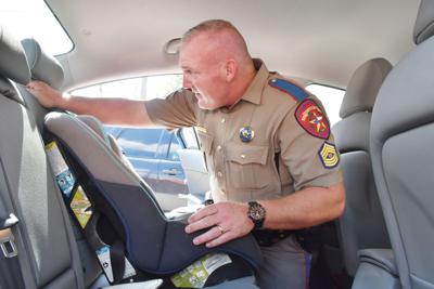 All buckled up: Trooper advocates proper car seat use for ...